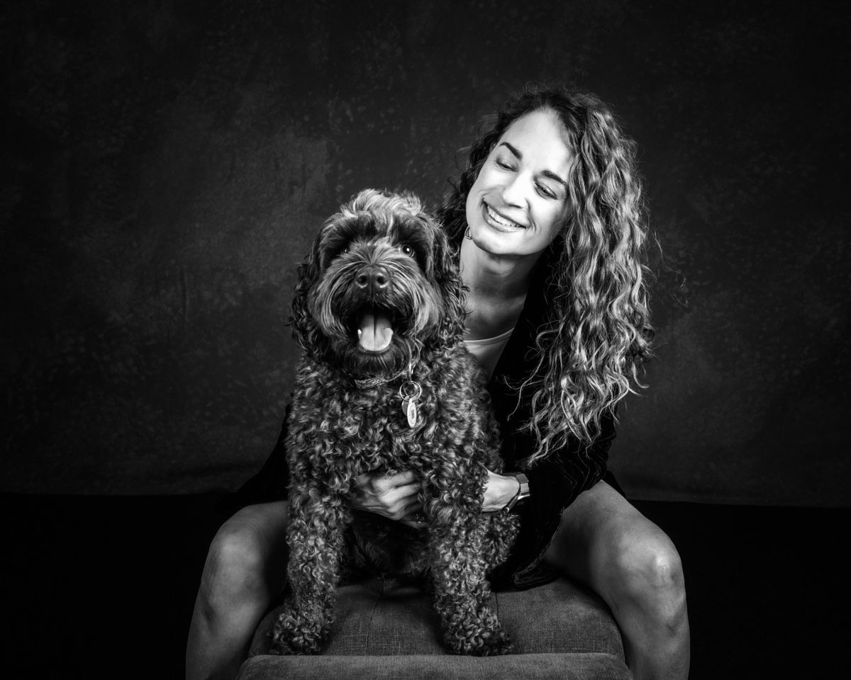 Jonna sitting with her doodle on her lap
