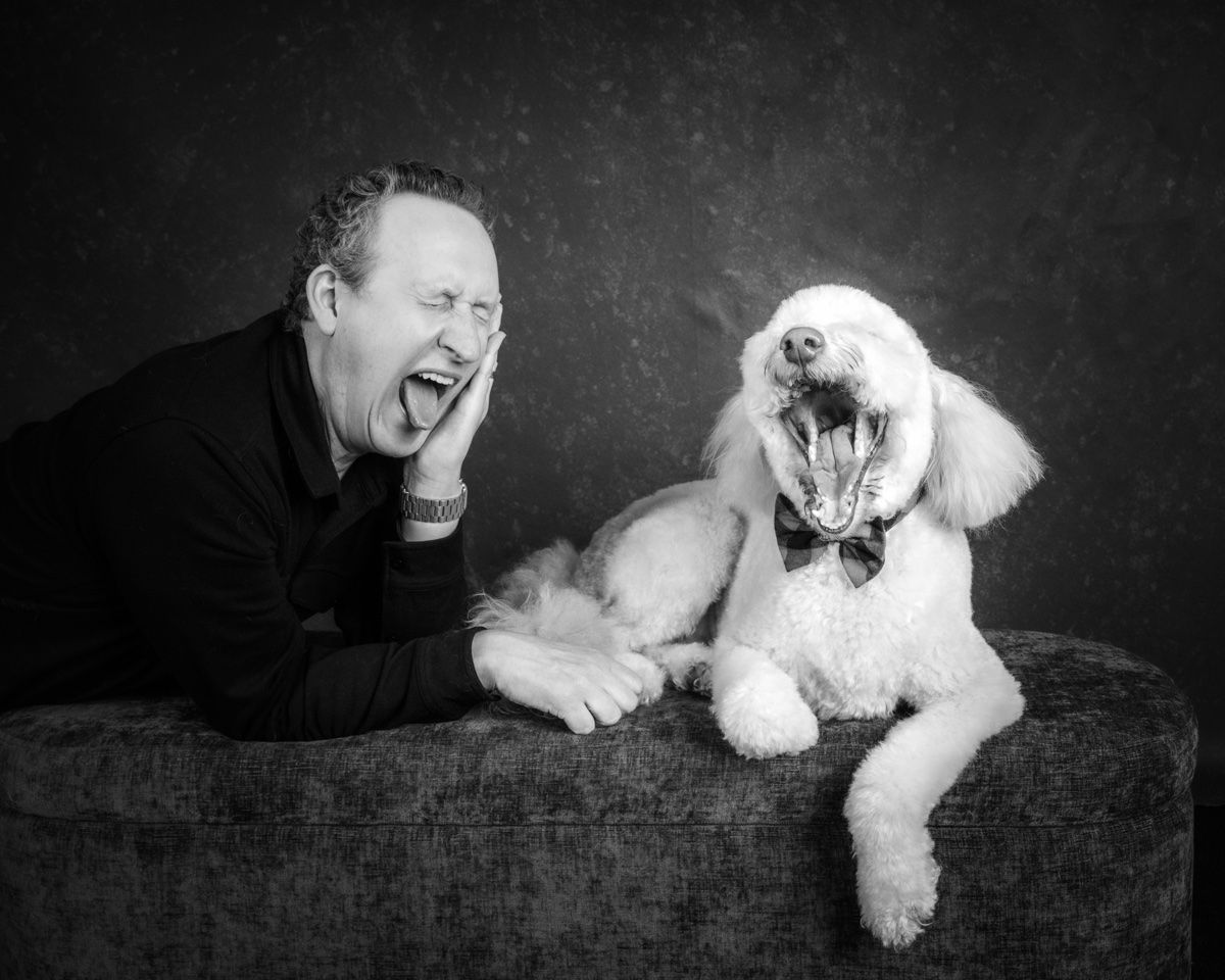 The husband laughing with the poodle
